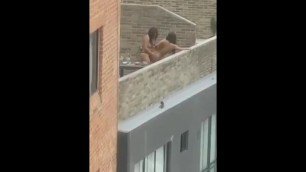 Lesbian couple fucking on balcony