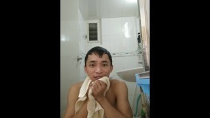 Asian man taking a shower