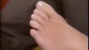 Kelly Ripa showing her perfect polish toes on TV
