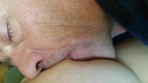 Baby girl breast feeds a daddy